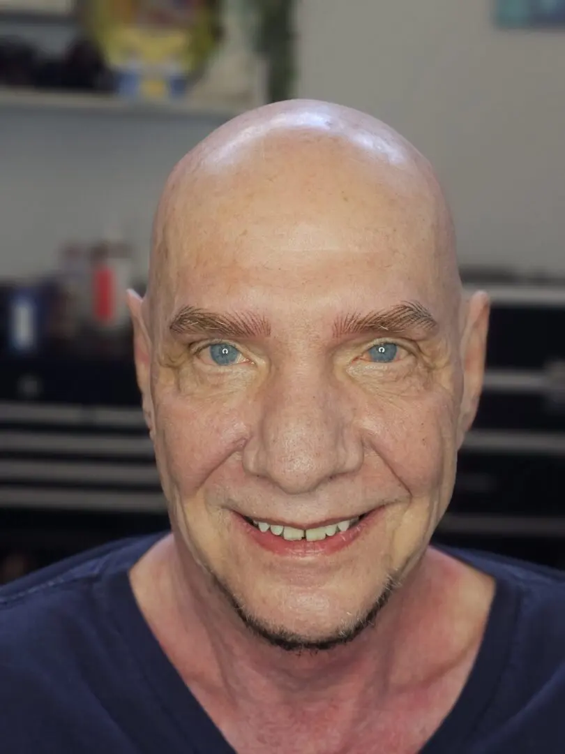 Smiling bald middle-aged man close-up